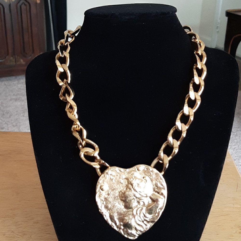 Jewels by Rio vintage  gold toned necklace with large gold toned pendant.